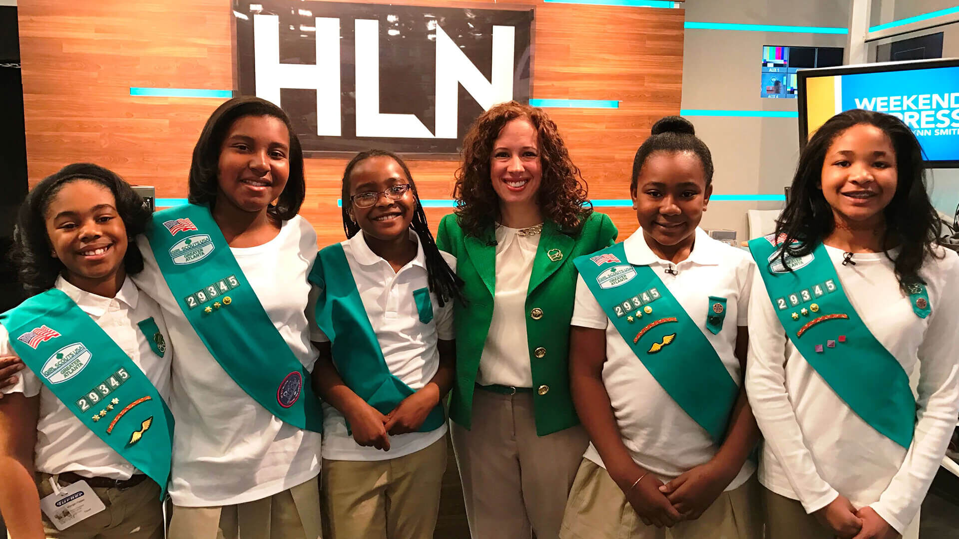 girl scouts standing with the CEO 